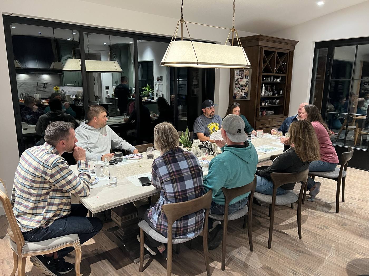 Retreat members gathered around a long dinner table